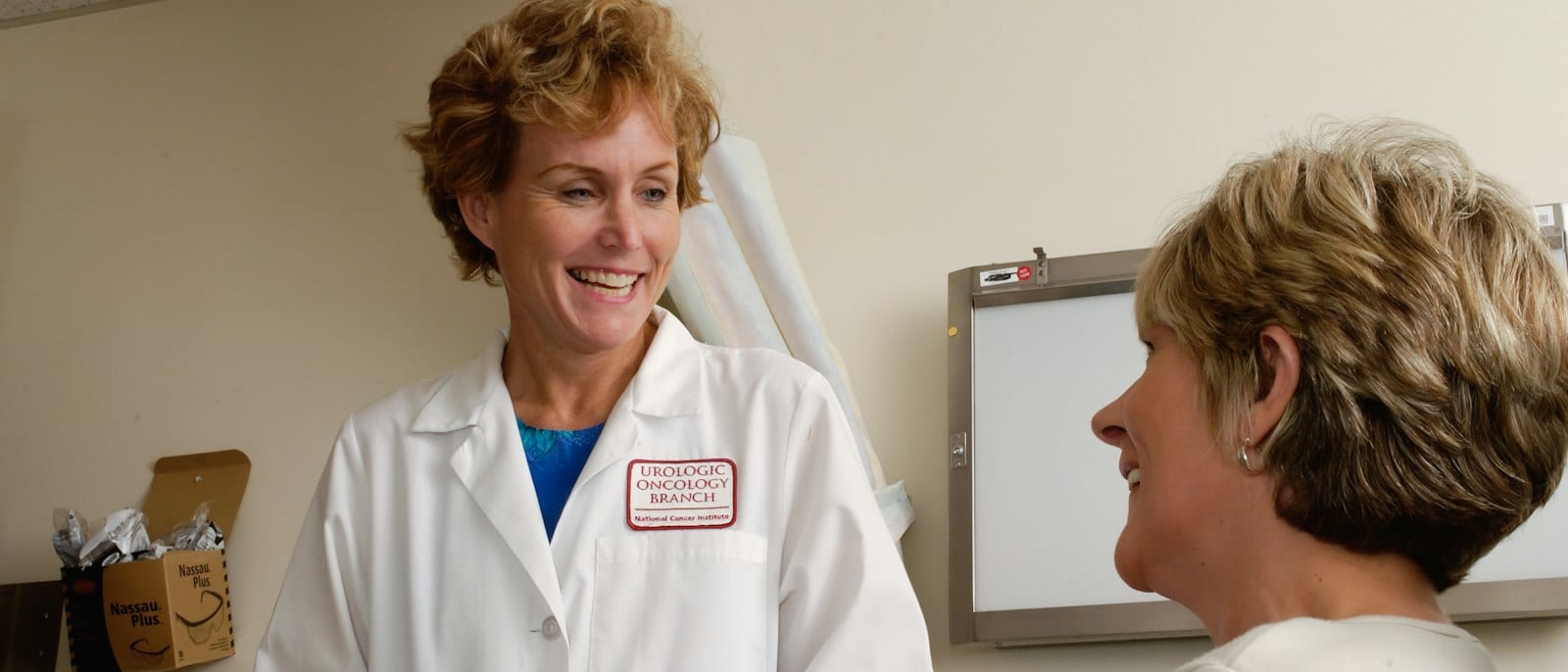 Doctor talking with a patient in an exam room